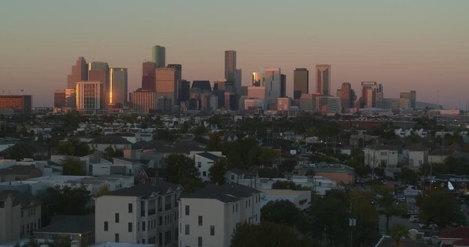 Establishing shot of downtown Houston at sunset from Almeda Drive