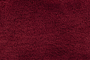 Deep red burgundy sherpa fleece fabric background © MAXSHOT_PL