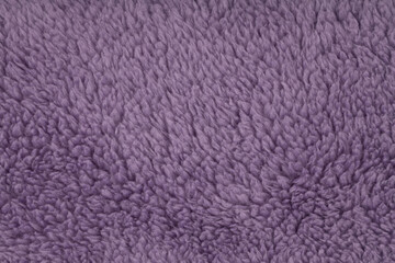 Fluffy purple sherpa fleece fabric background texture