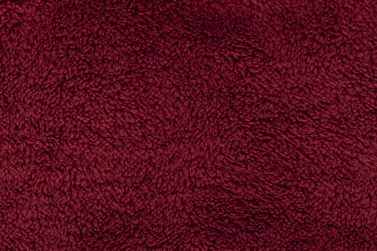 Deep red burgundy sherpa fleece fabric background