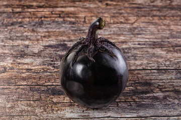 Raw round black big eggplant