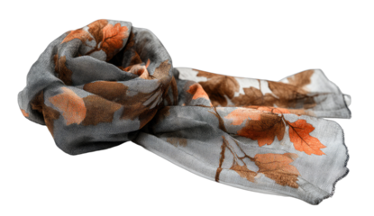 Soft gray and orange leaf-patterned scarf, elegantly folded, autumn fashion accessory