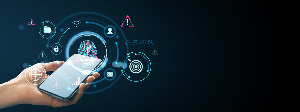 Hand holding smartphone with fingerprint scanner interface and digital security icons on dark background, illustrating mobile data protection concept.