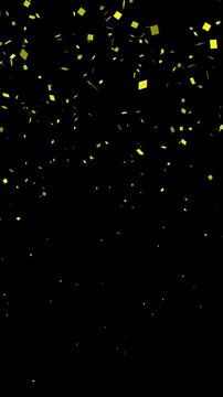 Falling explotion shiny yellow confetti isolated on transparent video black vertical background. Bright festive tinsel of black color.