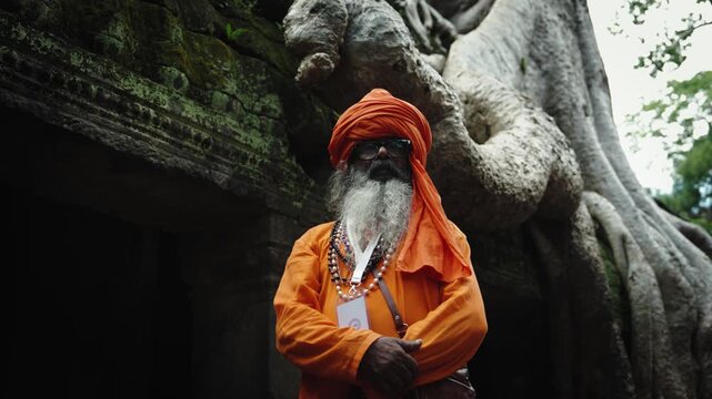 buddhist monk with orange robe pray in temple
