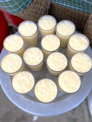 Buttermilk or mattha, Close-Up of summer drink Buttermilk or mattha or Chhachh glass garnished with coriander made with milk and curd. 
