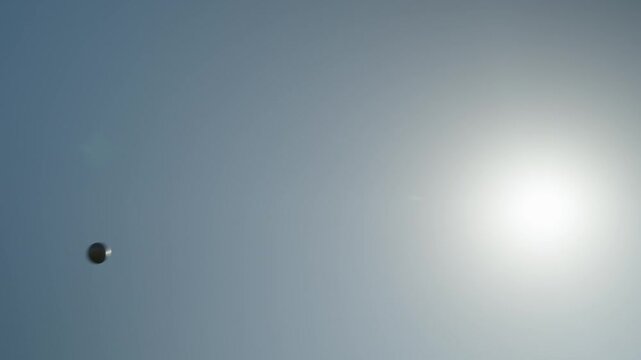 Flight of a shot shot against the background of the sky by an abandoned professional athlete