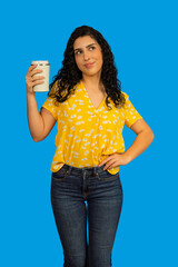 Woman holding travel mug thinking looking up