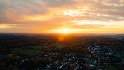 Aerial Sunset View over a Small Town Surrounded by Forest, Germany