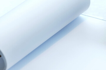 Close-up of a Rolled White Paper or Blank Canvas