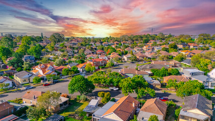 Aerial Panorama Drone View of a inner western Sydney Suburb of Ashbury Urban Sprawl and the terracotta roof tops streets and trees of Suburban Sydney  NSW Australia