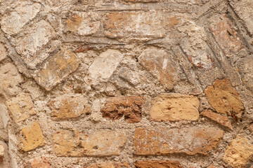 Old stone and brick masonry wall close-up