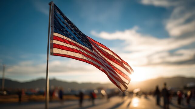 Waving American flag against a clear blue sky for patriotic holidays - Powered by Adobe