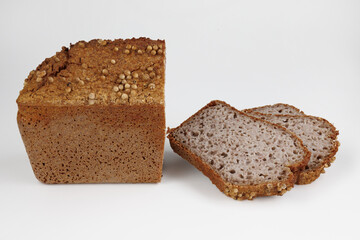 Sliced buckwheat slab on white background.