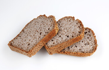 Pieces of sliced buckwheat bread on white background.