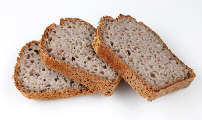 Pieces of sliced buckwheat bread on white background.