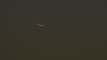 Tokyo, Japan - November 17, 2025: Contrail or airplane track at dusk