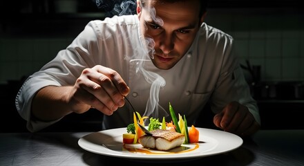 A professional chef carefully garnishes a gourmet dish with fresh vegetables and herbs in a dimly lit kitchen setting