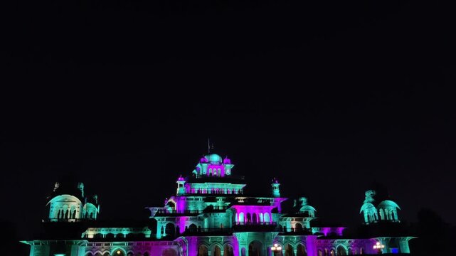 Jaipur, India 10 November 2025: Footage of Albert Hall museum at pink city Jaipur illuminated with lights at night against dark background
