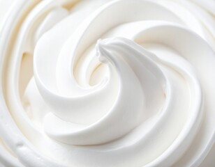 Macro photograph of a creamy, swirling white texture, resembling soft-serve ice cream or whipped cream