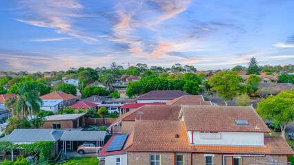 Aerial Panorama Drone View of a inner western Sydney Suburb of Ashbury Urban Sprawl and the terracotta roof tops streets and trees of Suburban Sydney  NSW Australia