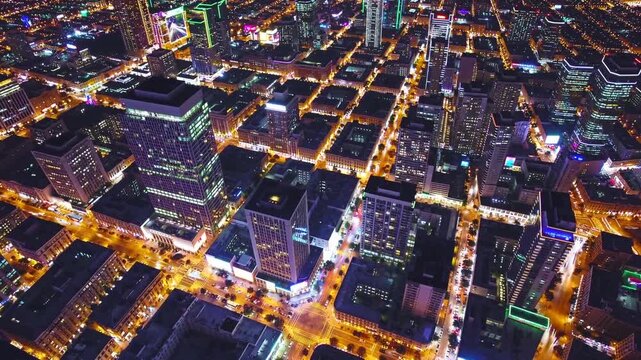 Vibrant city lights illuminate downtown at night showcasing a busy urban landscape