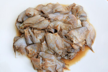 Pickled fish, Fish fermented with salt and roast rice on white background. Traditional Thai style raw preserved fish thai call Pla-ra.