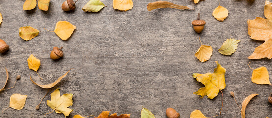 Autumn composition made of dried leaves, cones and acorns on table. Flat lay, top view