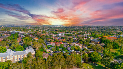 Aerial Panorama Drone View of a inner western Sydney Suburb of Ashbury Urban Sprawl and the terracotta roof tops streets and trees of Suburban Sydney  NSW Australia