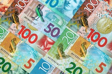 New Zealand dollar money bills in big amount on table close up. Rich life concept in New Zealand. Business and economy
