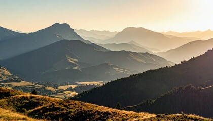 A breathtaking view of layered mountain ranges bathed in the warm glow of golden hour sunlight, with valleys and forests visible.