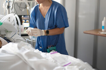 Nurse student caring for a patient in ICU