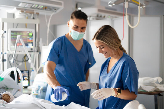 Nursing professor mentoring student in the ICU environment