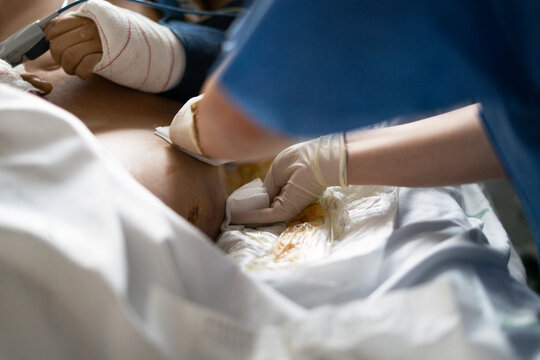 Nurse student caring for patient in ICU setting