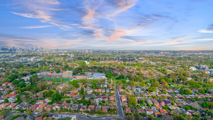 Aerial Panorama Drone View of a inner western Sydney Suburb of Ashbury Urban Sprawl and the terracotta roof tops streets and trees of Suburban Sydney  NSW Australia