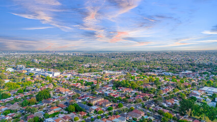 Aerial Panorama Drone View of a inner western Sydney Suburb of Ashbury Urban Sprawl and the terracotta roof tops streets and trees of Suburban Sydney  NSW Australia