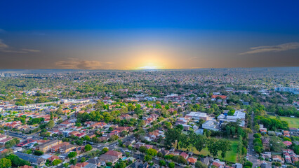 Aerial Panorama Drone View of a inner western Sydney Suburb of Ashbury Urban Sprawl and the terracotta roof tops streets and trees of Suburban Sydney  NSW Australia