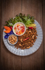 Fried catfish spicy salad, Asian Thai cuisine food. Serve with sweet and sour spicy sauce
