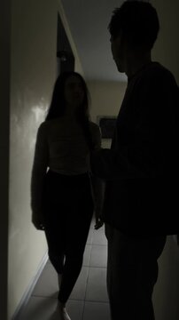 Boyfriend hides phone after being caught texting by girlfriend, shocking moment of suspected cheating. Vertical Video