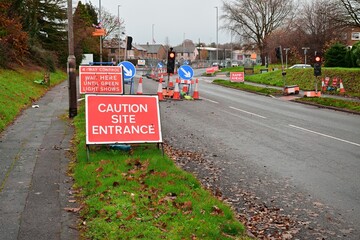 Road Construction Zone with Warning Signs and Temporary Traffic Lights