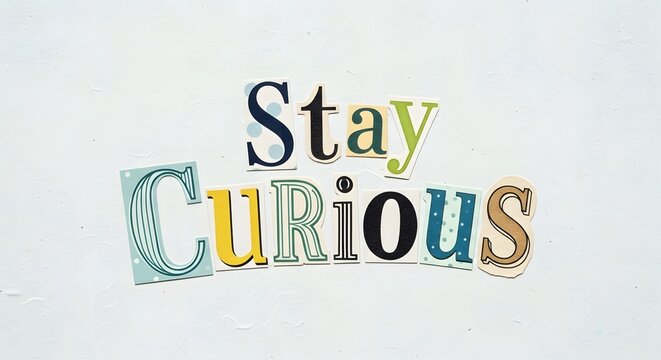 A colorful and playful arrangement of cut-out letters spelling the phrase 'Stay Curious' on a plain white background encouraging creativity and exploration