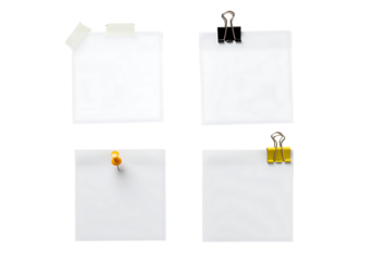 Blank white papers arranged with clips tape and a pin on black background.