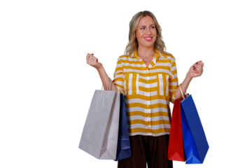 Happy and smiling woman holding shopping bags enjoying retail therapy on a shopping spree, transparent background