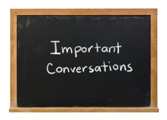 Important conversations written in white chalk on a black chalkboard isolated in a wooden frame