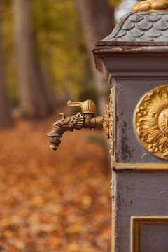 Close-up of ornate rusted iron water fountain