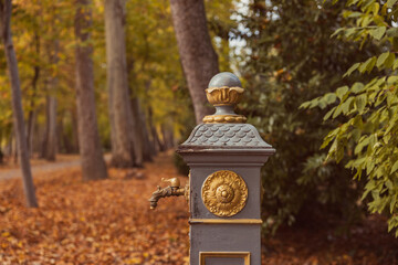Close-up of ornate rusted iron water fountain
