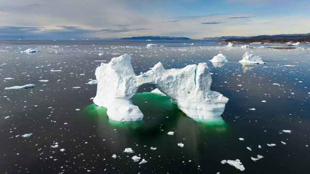 Arctic ice arch in serene Ilulissat waters