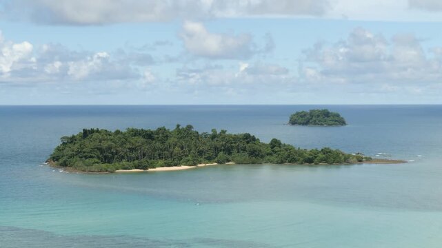 Aerial view, small islands near Koh Chang in Thailand, showing turquoise water, tropical coastline, forested landforms and peaceful scenery ideal for travel, tourism and nature content