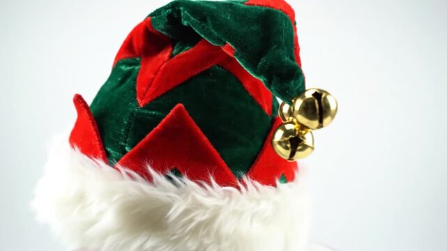 3230155 319 festive elf hat with jingle bells on white backdrop 21347067 1