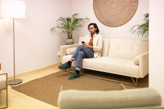 Modern psychologist's waiting room with patient seated
